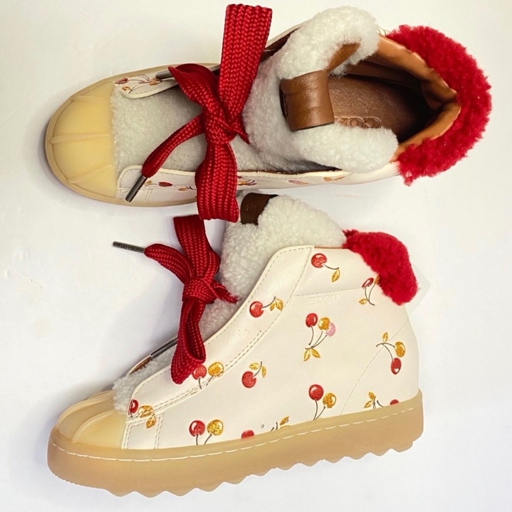 Coach High Top Hiker boots featuring cherry print and cozy shearling lining.